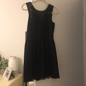 Black cocktail dress with lace lace detailing